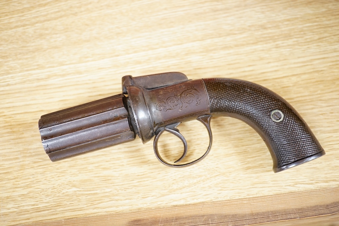 A six shot 120 bore self-cocking percussion pepperbox revolver with fluted barrels, Birmingham proof, rounded foliate engraved frame, and two-piece chequered walnut grips